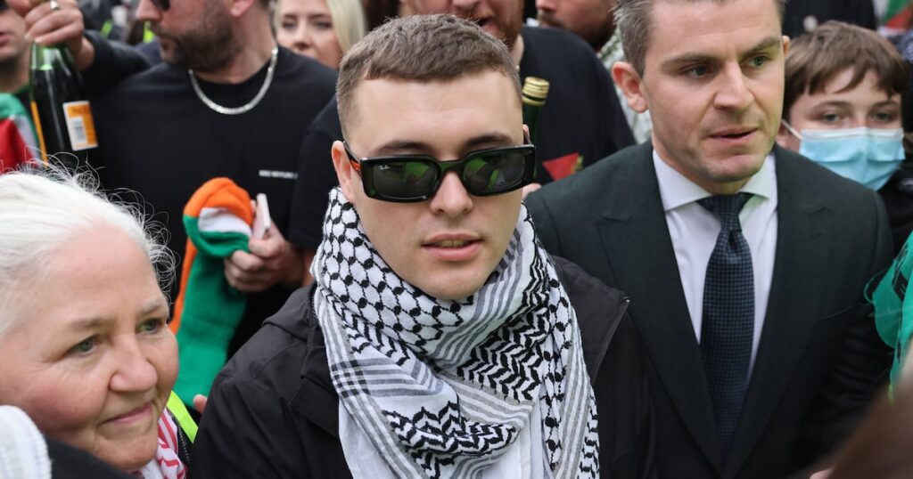 UK Court Rules Kneecap Rapper Will Not Face New Terror Trial – The Irish Times
