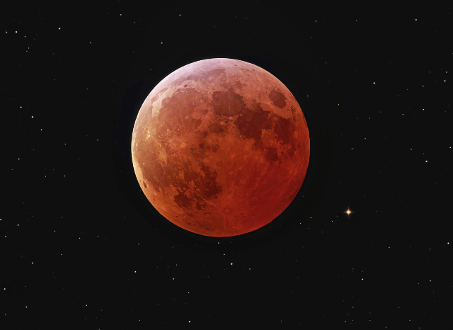 A Red Moon on a dark background